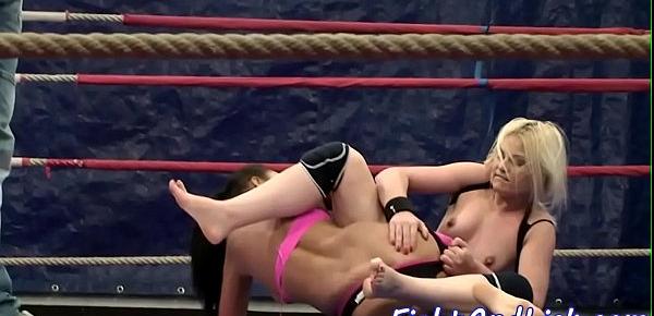  Athletic lesbians wrestling in a boxing ring